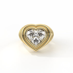 Gold heart-shaped diamond ring on a white background