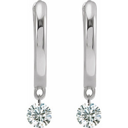 Pair of silver earrings with round gemstones on a white background