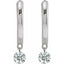 Pair of silver earrings with round gemstones on a white background