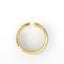 Gold hoop earring with embedded stones on a white background