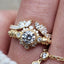 A diamond wing ring jacket over a diamond skull ring