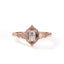 Rose gold ring with diamond on a white background