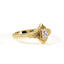 Gold ring with a diamond on a white background