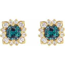 Pair of gold earrings with green gemstones on a white background