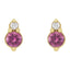 Gold earrings with pink gemstones on a white background