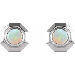Pair of hexagonal earrings with opal stones on a white background