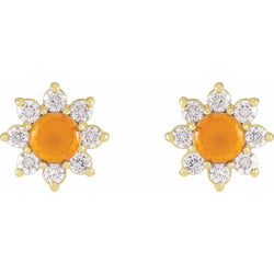 Pair of flower-shaped earrings with orange centers and diamond-like stones on a white background