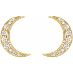 Gold crescent moon earrings with embedded diamonds on a white background