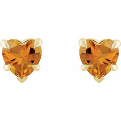 Heart-shaped orange gemstone earrings on a white background