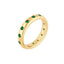A emerald eternity band made in 14k yellow gold with round emeralds set around the ring. 