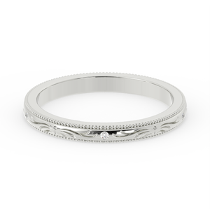 Silver ring with intricate design on a white background