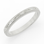 Silver ring with intricate design and small diamonds on a white background