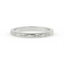 Silver ring with intricate design on a white background