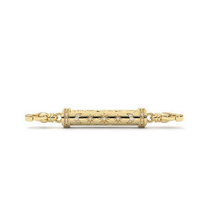 Gold bracelet with star and moon designs on a white background