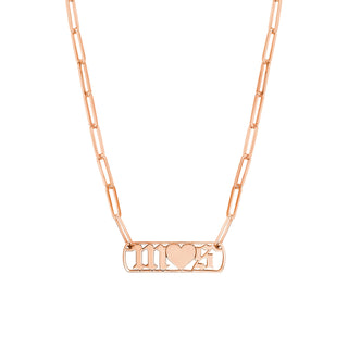 A gothic font initial necklace with a heart in the middle. Finished with paperclip chain. 