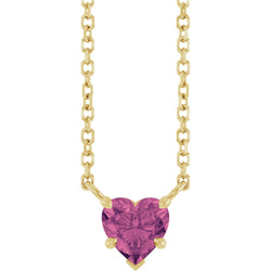 Gold necklace with a heart-shaped purple gemstone on a white background