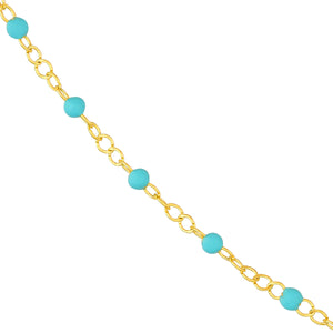 Product picture of an enamel beaded station chain. This chain has a color beaded element spaced with gold cable links. Showing turquoise color close up. 