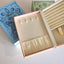 A jewelry box that is made like a book. With magnets at the closure, this book shaped jewelry box can be opened to reveal ring slots, necklace storage and bracelets and earrings too. Comes in three different colors and themes. Fortune, rose, and beauty