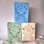 A jewelry box that is made like a book. With magnets at the closure, this book shaped jewelry box can be opened to reveal ring slots, necklace storage and bracelets and earrings too. Comes in three different colors and themes. Fortune, rose, and beauty