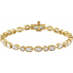 Gold bracelet with diamond accents on a white background