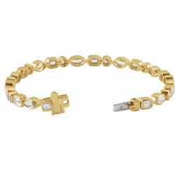 Gold bracelet with diamond accents on a white background