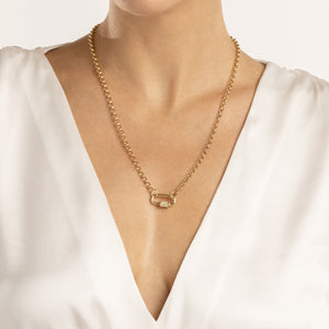 Product picture of a solid gold carabiner lock. The screw is a six sided barrel and has three diamonds on each side. The carabiner is a rounded rectangle shape. 