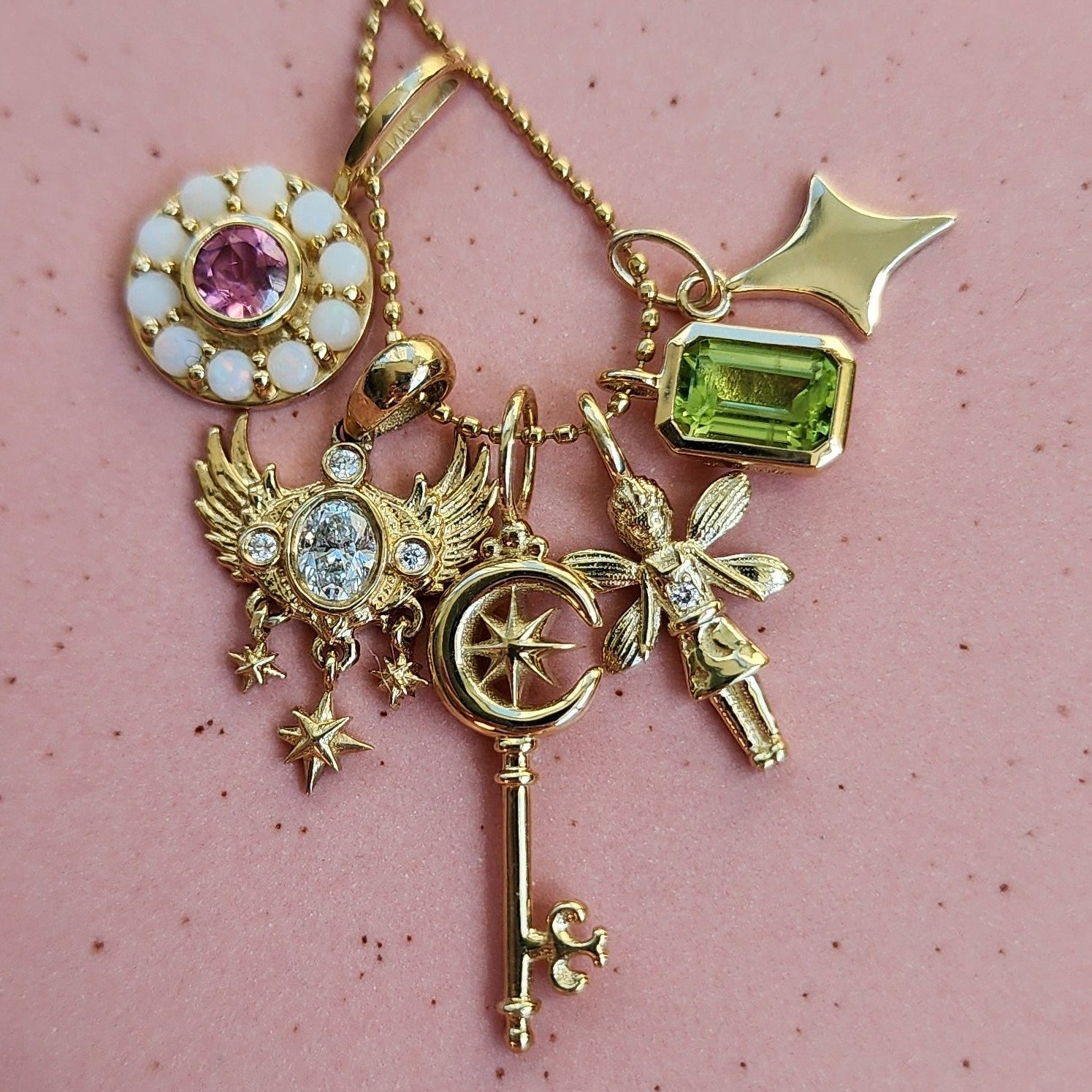 A four point star charm hanging on a beaded chain