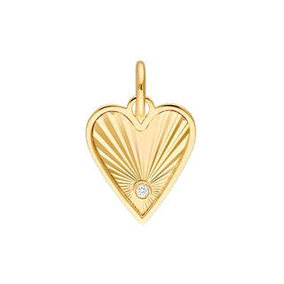 A solid gold fluted heart charm with a diamond. This charm has a fluted design that reflects light.  