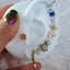 Product picture of a variety of different earring studs including the diamond paw stud. 