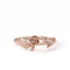 Rose gold ring with floral design on a white background