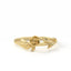 Gold ring with a rose design on a white background