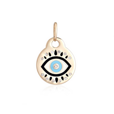 A solid gold round disc Evil eye charm with enamel design. blue enamel colored eye with black almond eye shape and diamonds. 