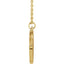 A gold round coin pendant with a butterfly center with detailed wings  and decorated frame on a chain.