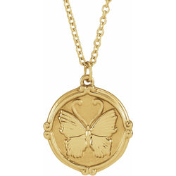 A gold round coin pendant with a butterfly center with detailed wings  and decorated frame on a chain.
