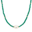 A green beaded gemstone necklace with spaced gold accents and center pearl with two spacer beads on each side. 