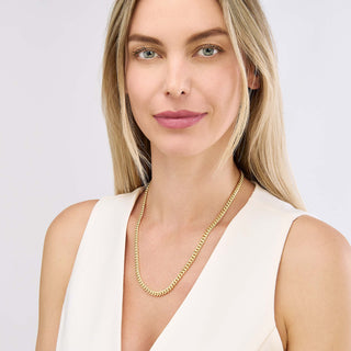 A 5mm gold Miami Cuban necklace chain, the perfect Statement size, in yellow gold with small oval links. This chain has a lobster clasp closure.