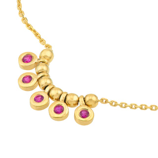 A solid gold bezel set ruby shaker necklace with a cable chain. Made to attract love. Finished with a pear lobster clasp. 