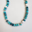 A large turquoise blue beaded necklace with pearls hand knotted with crystals for a mixed look. Finished with solid gold findings and gold clasp. 