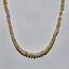 A high quality hand knotted Ethiopian white opal with silk threads and gold beaded accents and wheel clasp. 