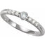 Silver ring with small diamonds on a white background