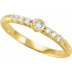Gold ring with small diamonds on a white background