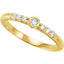Gold ring with small diamonds on a white background