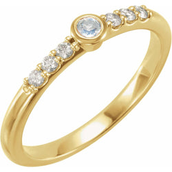 Gold ring with diamonds on a white background