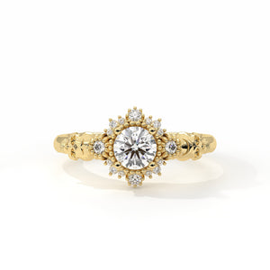 Gold ring with a central diamond and smaller diamonds on a white background