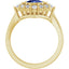 Gold ring with a blue gemstone and diamonds on a white background