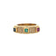 A vintage ring with three colored gemstones princess cut. Emerald in the middle and ruby and blue sapphire on either side with diamonds in between. 