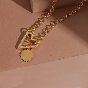 A heart shaped lock connector with diamond pave set on the front. Spring push clasp for easy and secure closure. 