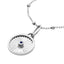 A round pendant with a ray design going toward a center sapphire. The sapphire is bezel set along with a plain white gold boarder.