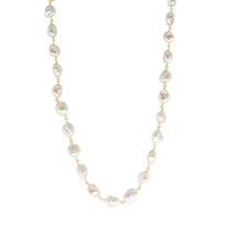 Pearl necklace with gold chain on a white background