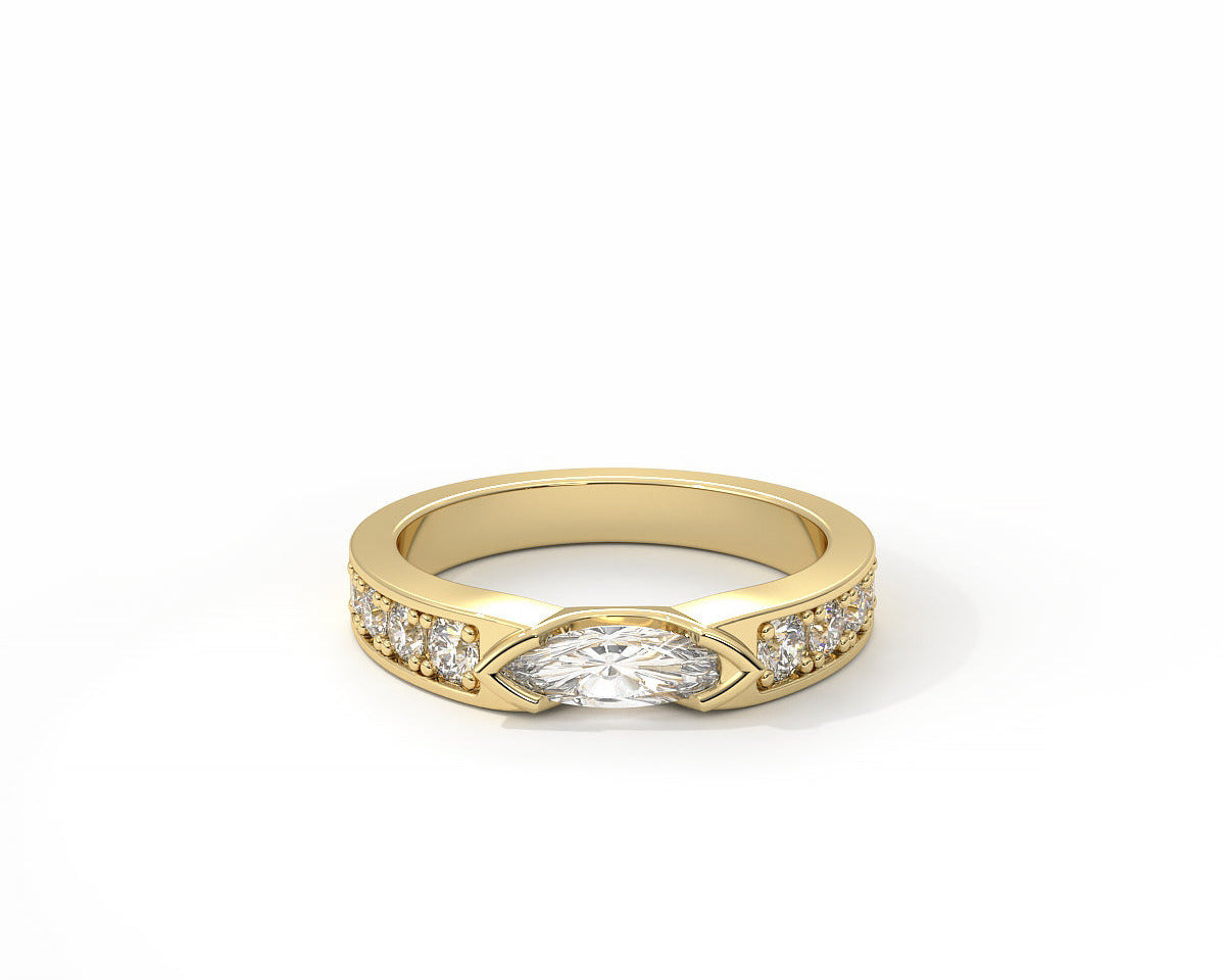Gold ring with a central diamond and smaller diamonds on a white background